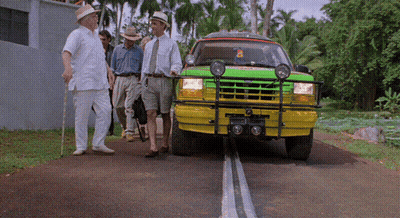 Men Beside Green And Yellow Vehicle License Plate A GIF