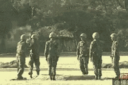 Men Cadet Plays With Bomb GIF