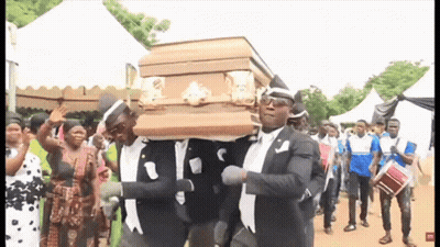 Men Carrying Coffin Dancing For Crowd GIF