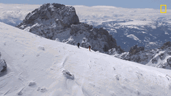 Men Climbing Snowy Mountain GIF