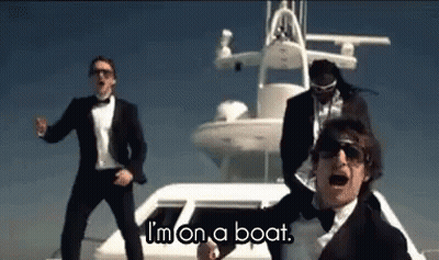 Men Dancing By Boat Saying I'm On A Boat GIF