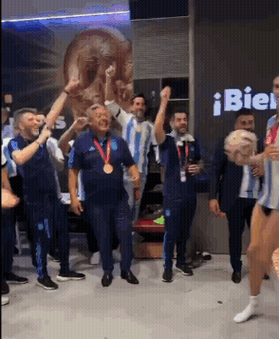 Men Dancing In Front Of Bien Sign GIF
