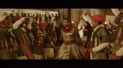 Men Dancing In Front Of Eros Screen GIF
