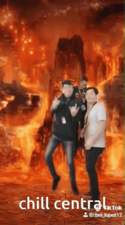 Men Dancing In Front Of Fire Chill Central GIF