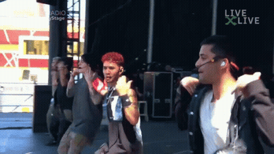 Men Dancing In Front Of Live Screen GIF