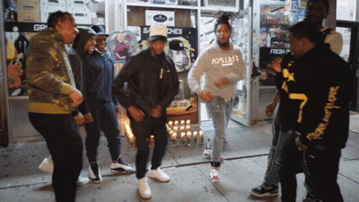 Men Dancing In Front Of Store Saying Gr GIF