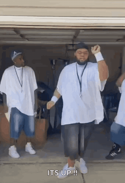 Men Dancing In Garage, One With Hat GIF
