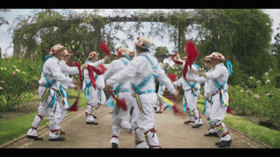Men Dancing In Garden Path GIF