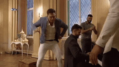 Men Dancing In Room With Stained Glass Window GIF