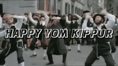 Men Dancing In Street Saying Happy Yom Kippur GIF