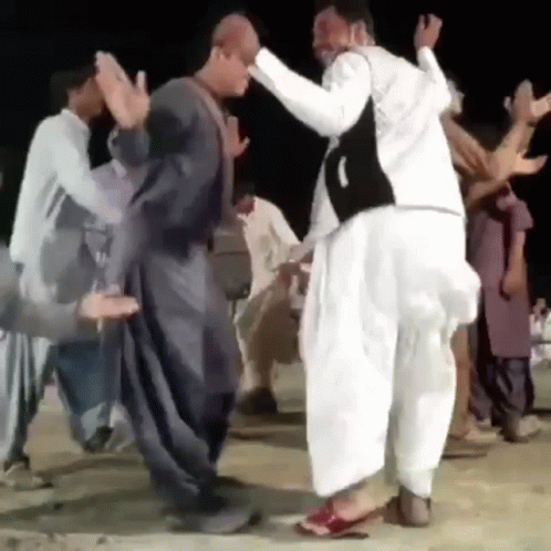 Men Dancing On Dirt Road GIF