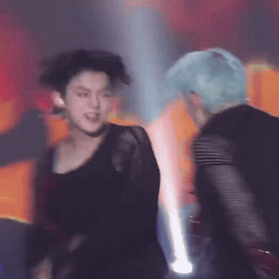 Men Dancing On Stage In Dark Room GIF