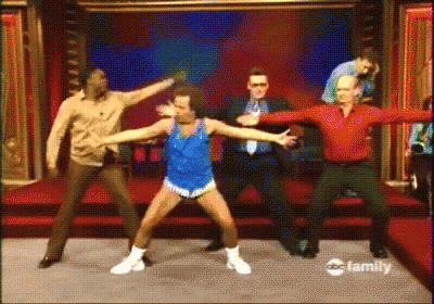 Men Dancing On Stage In Front Of ABC Family Sign GIF