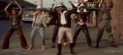 Men Dancing On Street With Brick Wall GIF