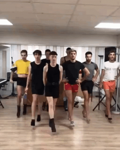 Men Dancing One Wearing Captain Shirt GIF