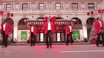 Men Dancing Outside Large Building GIF