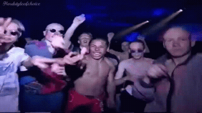 Men Dancing Shirtless In Dark Room GIF
