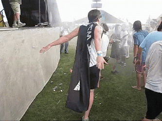 Men Enjoys Spraying Water At Coachella GIF