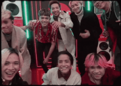 Men Hugging In Front Of March Poster GIF