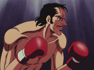 Men Hugging In Red And Black Boxing Gloves GIF