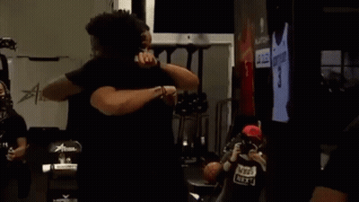 Men Hugging In Room GIF