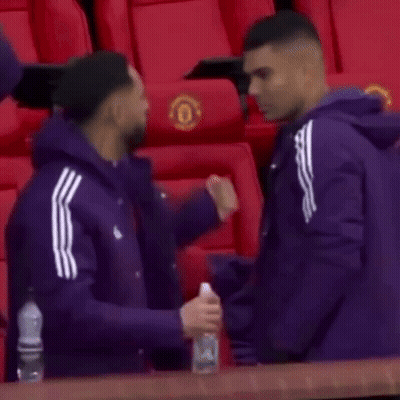 Men Hugging In Stadium GIF
