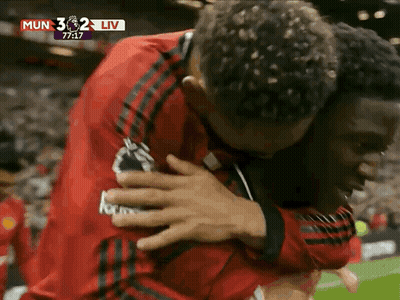 Men Hugging On Soccer Field GIF