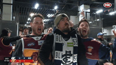 Men In AFL Jerseys Standing In Front Of Scoreboard GIF