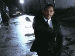 Men In Black Memory Eraser Head Shrug GIF