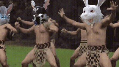 Men In Bunny Masks Dancing Together GIF