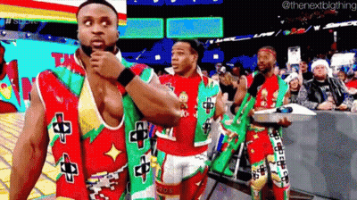 Men In Christmas Outfits In Wrestling Ring GIF