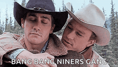 Men In Cowboy Hats Hugging GIF
