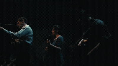 Men In Dark Hallway, One With Hat GIF