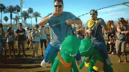 Men In Dinosaurs Costume Jumping Rope At Coachella GIF
