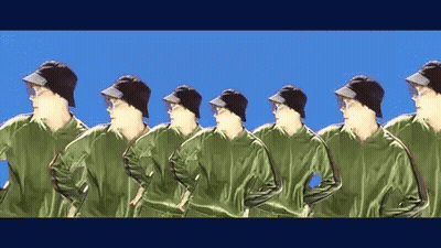 Men In Green Jackets And Black Hats In Row GIF