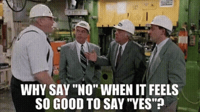 Men In Hard Hats Talking In Factory GIF