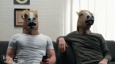 Men in Horse Masks Sitting