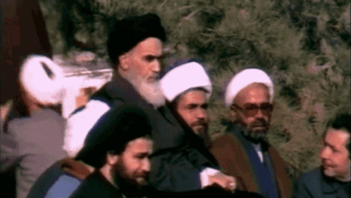 Men In Line, One With Beard And Hat GIF