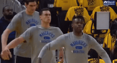 Men In Mavericks Shirts Standing In Line GIF