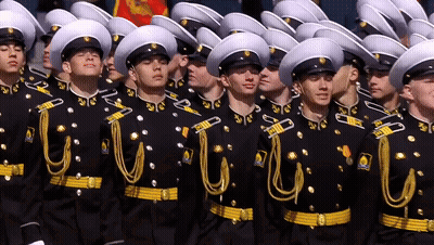Men In Military Uniforms Lined Up GIF