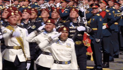Men In Military Uniforms Salute Marching In Parade GIF