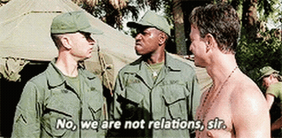 Men In Military Uniforms Standing And Talking GIF