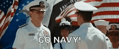 Men In Military Uniforms Standing Before American Flag GIF