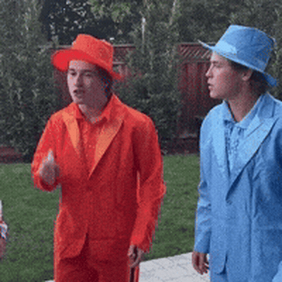 Men In Orange And Blue Suits GIF