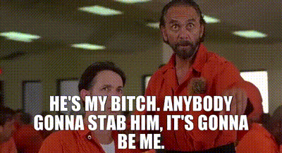 Men In Orange Jumpsuits Talking GIF
