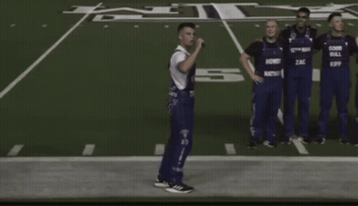 Men In Overalls Saying Good Bull On Football Field GIF