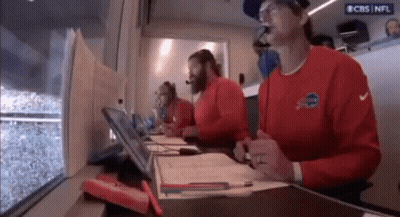 Men In Red Shirts With Buffalo At Table GIF