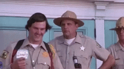 Men In Sheriff Uniforms By Door GIF