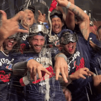 Men In Storm Chasers Jerseys Celebrating GIF