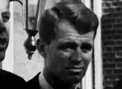 Men In Suit Standing Outside Brick Building GIF